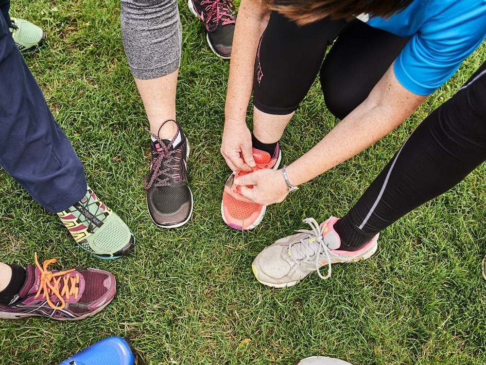 Lots of different shoes on feet