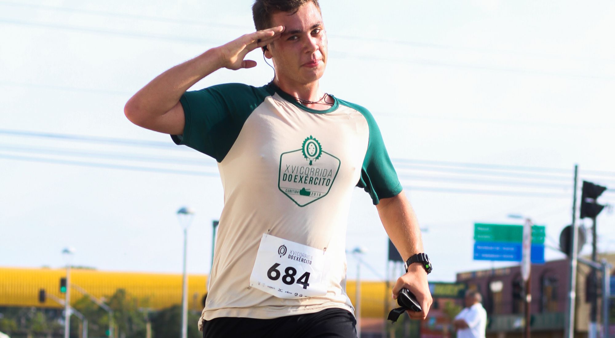 runner finishing race and saluting