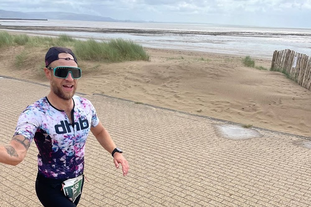 Dan Chaplen running on the beach